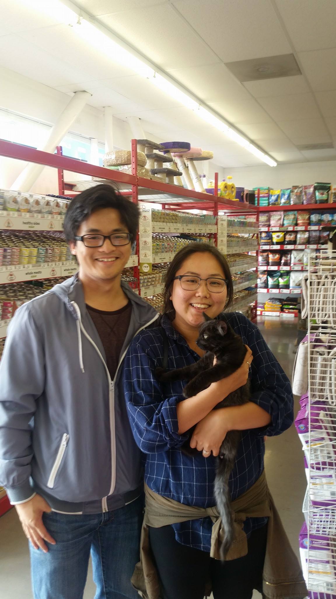 Smokey with his new family at Petfood Express